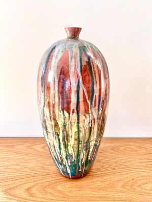 Tall Bottle - Raku Fired on a wooden surface